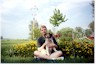 sitting with daddy by the flower garden